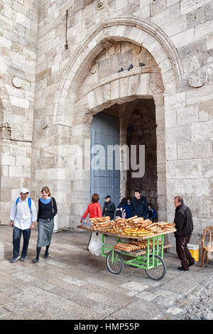 Bread seller at Jaffa Gate in the historic wall of the Old City. Jerusalem, Israel Stock Photo