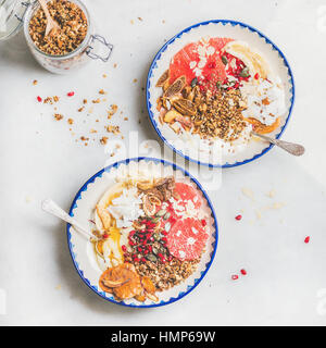Healthy breakfast yogurt bowls with granola, fruits, seeds, nuts Stock Photo