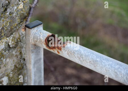 Rusted metal pole on a gate Stock Photo
