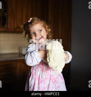 child preparing dough