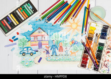 Childrens Creation With Sketch And Paints Stock Photo