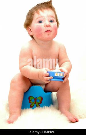 One year old child on potty Stock Photo