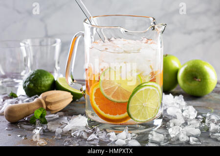 Infused water with citrus fruits in a pitcher