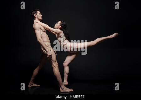 Beautiful young dance couple taking part in the art performance Stock Photo