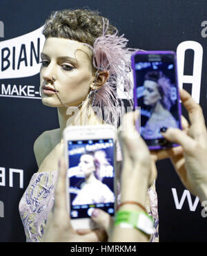 Kiev, Ukraine. 4th Feb, 2017. A model poses for a photo backstage, during the Ukrainian Fashion Week in Kiev, Ukraine.The fashion event presents Fall/Winter 2017/18 collections by Ukrainian and International designers, from 4 to 8 February. Credit: Serg Glovny/ZUMA Wire/Alamy Live News Stock Photo