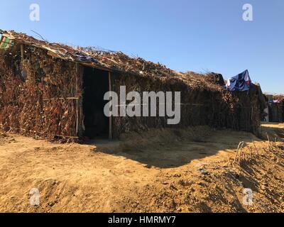 Ukhiya, Bangladesh. 26th Jan, 2017. These makeshift huts, made of bamboo slips and polyethylene papers as roof and covered by tree branches, are built by the Rohingya Muslims who crossed into Bangladesh facing persecution in neighbouring Myanmar. The photograph was taken by Nazrul Islam near Kutupalang refugee camp in Ukhiya sub-district of Cox·s Bazar on January 26, 2017. Photo: Nazrul Islam/dpa/Alamy Live News Stock Photo