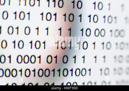 Binary code on a computer screen themes of binary code data pattern Stock Photo