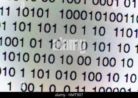 Binary code on a computer screen themes of binary code data pattern Stock Photo