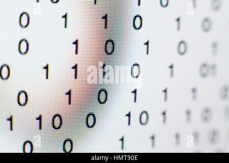 Binary code on a computer screen themes of binary code data pattern Stock Photo