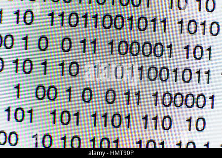 Binary code on a computer screen themes of binary code data pattern Stock Photo