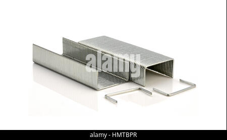 Stack of metal staples on a white background Stock Photo