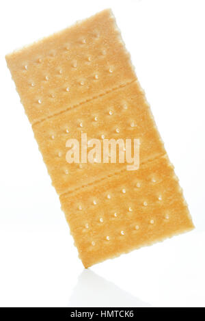 one cracker cookie isolated on white stand on corner Stock Photo