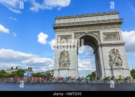 Paris, France - July 24, 2016: The peloton (including the major distinctive jerseys) passing by the Arch de Triomphe on Champs Elysees in Paris during Stock Photo