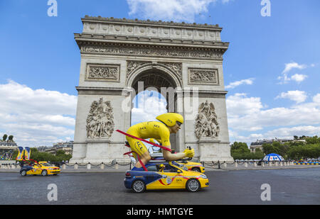 Paris, France - July 24, 2016: The speicific yellow cyclist mascot of LCL during the passing of The Publicity Caravan by the Arch de Triomphe on Champ Stock Photo