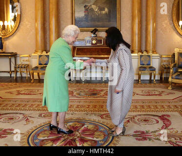 London, UK. 12th Feb, 2015. 12 February 2015 - London, England - Queen Elizabeth II presents Imtiaz Dharker with The Queen's Gold Medal for Poetry, as Poet Laureate Carol Ann Duffy looks on, at Buckingham Palace. Photo Credit: Alpha Press/AdMedia Credit: Alpha Press/AdMedia/ZUMA Wire/Alamy Live News Stock Photo