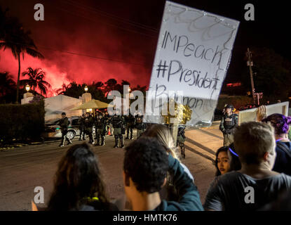 West Palm Beach, Florida, USA. 4th Feb, 2017. Protesters against President Donald Trump marched to the back gate of Mar-a-Lago where the President was attending the Red Cross Ball at the winter White House in Palm Beach, Fl on February 4, 2017. Fireworks light up the sky above Mar-a-Lago. Credit: Allen Eyestone/The Palm Beach Post/ZUMA Wire/Alamy Live News Stock Photo