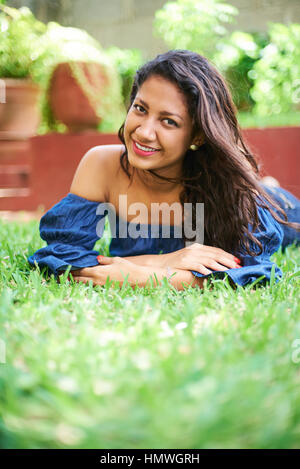 Young beauty girl laying on autumn ground and leaves, perfect face and