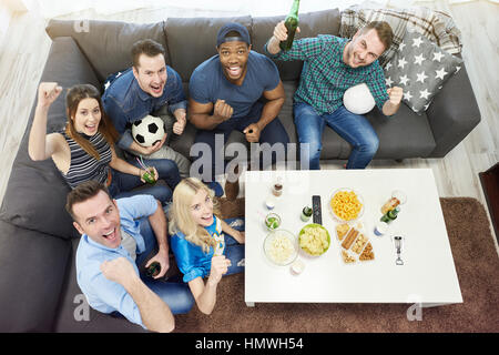 All of best friends watching football match Stock Photo