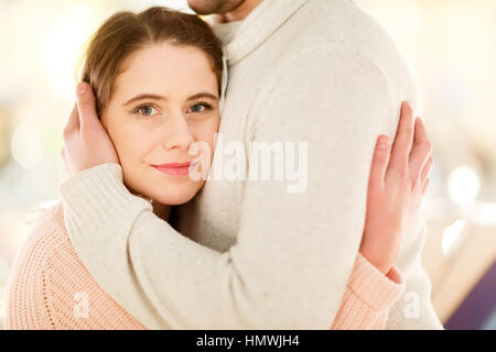 Nice man and woman hugging in shopping center Stock Photo