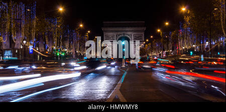 Champs Elysees in Paris illuminated for Christmas and Triumphal Arch in background Stock Photo