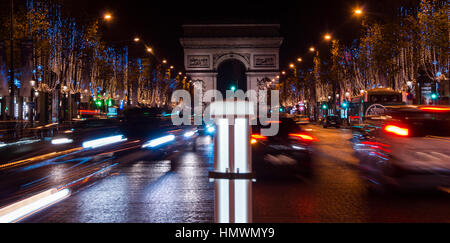 Champs Elysees in Paris illuminated for Christmas and Triumphal Arch in background Stock Photo