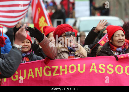 New York City, USA. 05th Feb, 2017. Celebrations for the Chinese Lunar New Year of the Rooster continued in Manhattan's Lower East Side with a parade along Sara Roosevelt Park featuring dragons & floats. Inside the park families received samples of Chinese calligraphy & lucky notes from cherry blossom trees Credit: Andy Katz/Pacific Press/Alamy Live News Stock Photo