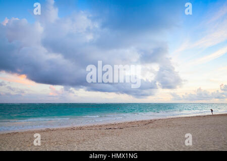 Atlantic ocean coast. Landscape with dramatic cloudy sky in sunrise, Dominican republic. Punta Cana. Bavaro beach Stock Photo