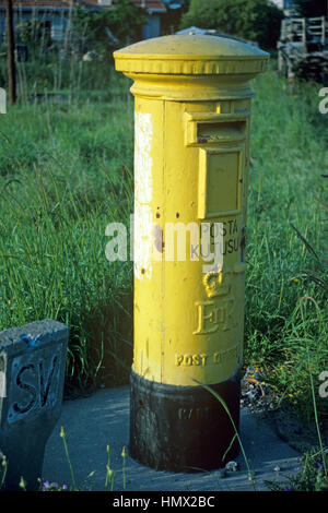 Old or Vintage British or British-era Yellow Postbox, Pillar Box or Letter Box near Kyrenia Northern Cyprus Stock Photo
