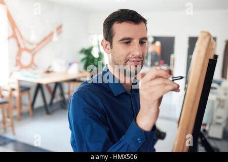 Businessman writing ideas on a whiteboard in an office Stock Photo