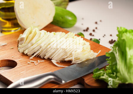 Chef Chopping Vegetables On A Wooden Cutting Board Stock Photo, Picture and  Royalty Free Image. Image 32124885.