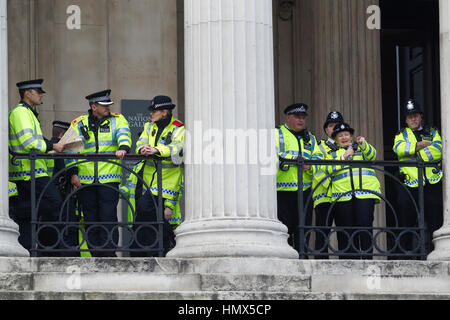 Metropolitan police on duty during an anti-cuts protest in Central London, England, United Kingdom