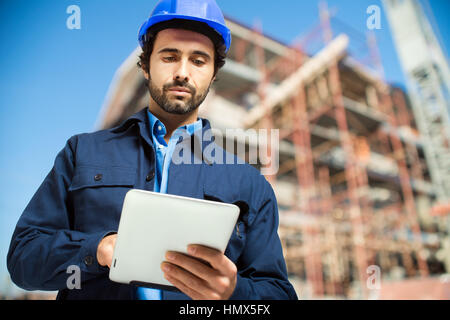 Construction specialist using a tablet computer Stock Photo