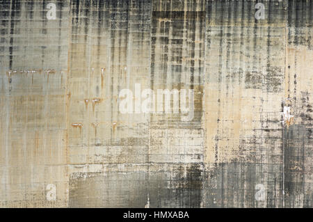 concrete arch dam face showing water staining and form patterns Stock Photo
