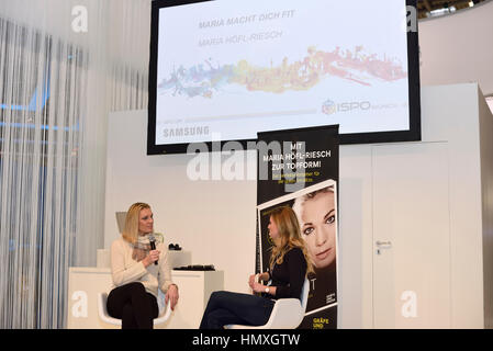 Munich, Germany. 6th February, 2017. Maria Höfl-Riesch (left side), former German alpine ski racer and Olympic gold medalist, presents her new fitness book 'Maria macht dich fit/Maria makes you fit' at the ISPO winter sports tradefair in Munich, Germany. Stock Photo