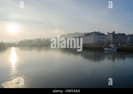 Sunrise on a misty winter morning in Honfleur, Normandy Stock Photo