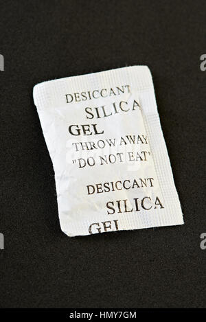 package of silica gel isolated on black background Stock Photo