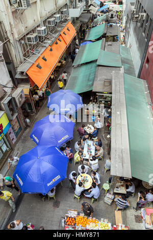 A lot of people walking and dining on the Stanley Street in Central on Hong Kong Island in Hong Kong, China, viewed from above. Stock Photo