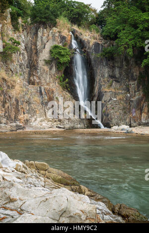 Bay, steep cliff and a waterfall at the Waterfall Bay Park in Hong Kong, China. Stock Photo