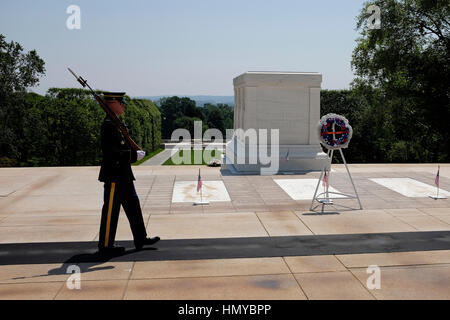 A soldier stands guard at The Tomb of The Unknown Soldier in Arlington National Cemetery. Stock Photo