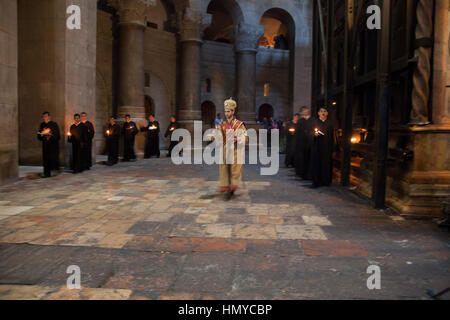 Jerusalem, Israel - June 15, 2014: Armenian Apostolic procession in Rotunda in the Church of Holy Sepulchre in Jerusalem. Armenian Apostolic community Stock Photo