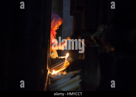 Jerusalem, Israel - May 30, 2014: A pilgrim prays by the Aedicule in Holy Sepulchre Church in Jerusalem Stock Photo