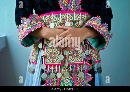 Teen girl wearing a Hmong Kao Traditional Dress.  Girl: Zao Yang Stock Photo