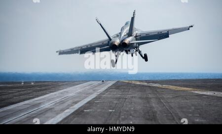 A U.S. Navy F/A-18E Super Hornet fighter aircraft launches from the flight deck of the USN Nimitz-class supercarrier USS Carl Vinson January 16, 2017 in the Pacific Ocean. Stock Photo