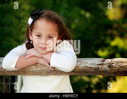Outdoor portrait of a beautiful African American/mixed race little girl Stock Photo