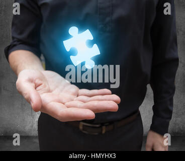 businessman hand offers solution Stock Photo