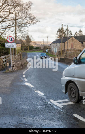 Give way to oncoming vehicles road sign. Give way sign at a narrow bridge, Brough, Derbyshire, England,UK Stock Photo