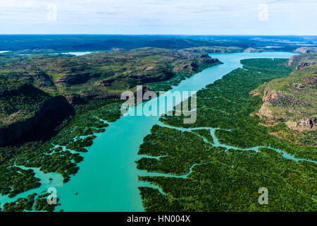 An aerial view of river tidal inlets winding their way through mangrove forests. Stock Photo