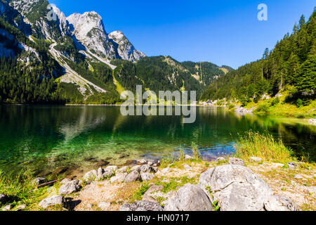 Fantastic azure alpine lake Vorderer Gosausee. Unusual and picturesque scene. Salzkammergut is a famous resort area Stock Photo