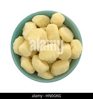 Top view of plain potato gnocchi in a green bowl isolated on a white background. Stock Photo