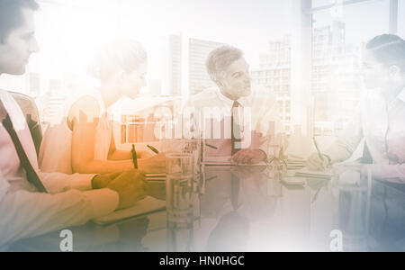 Serious businessman during a meeting talking to his employees in the meeting room Stock Photo